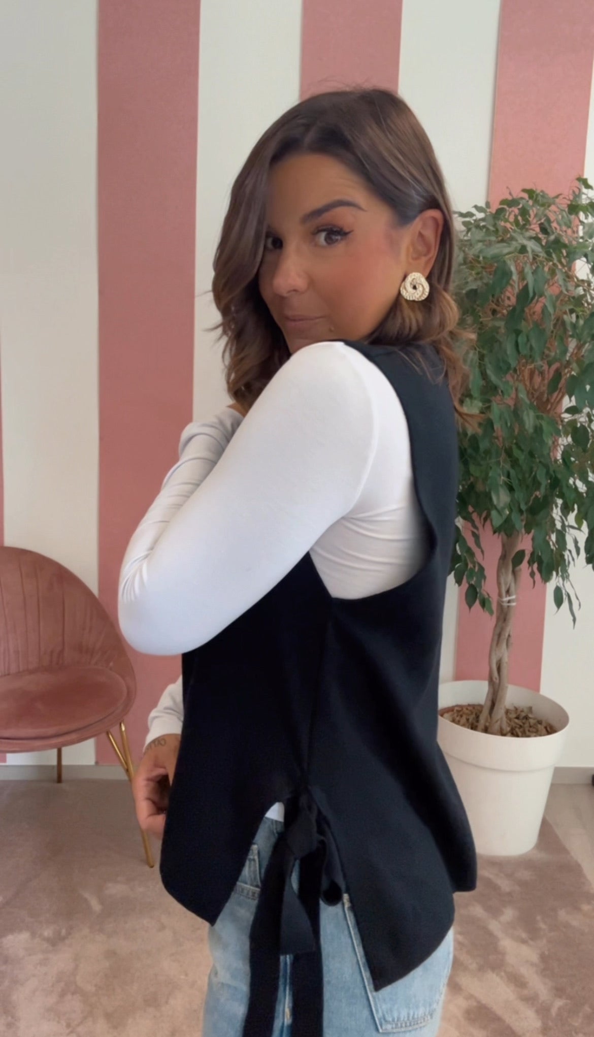 Gilet con fiocchi laterali