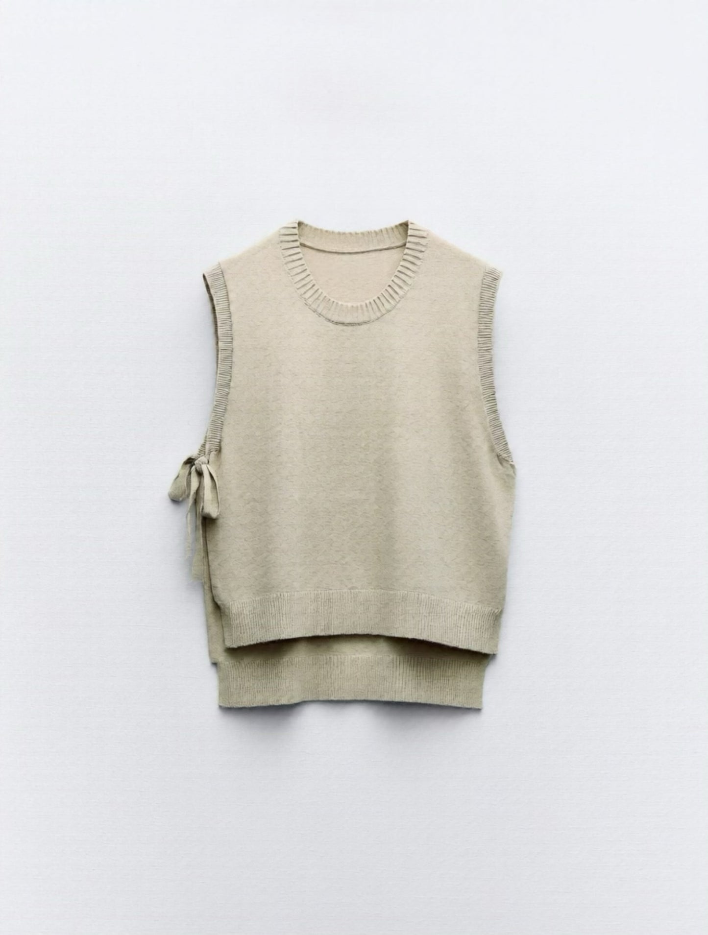 Gilet con fiocchi laterali